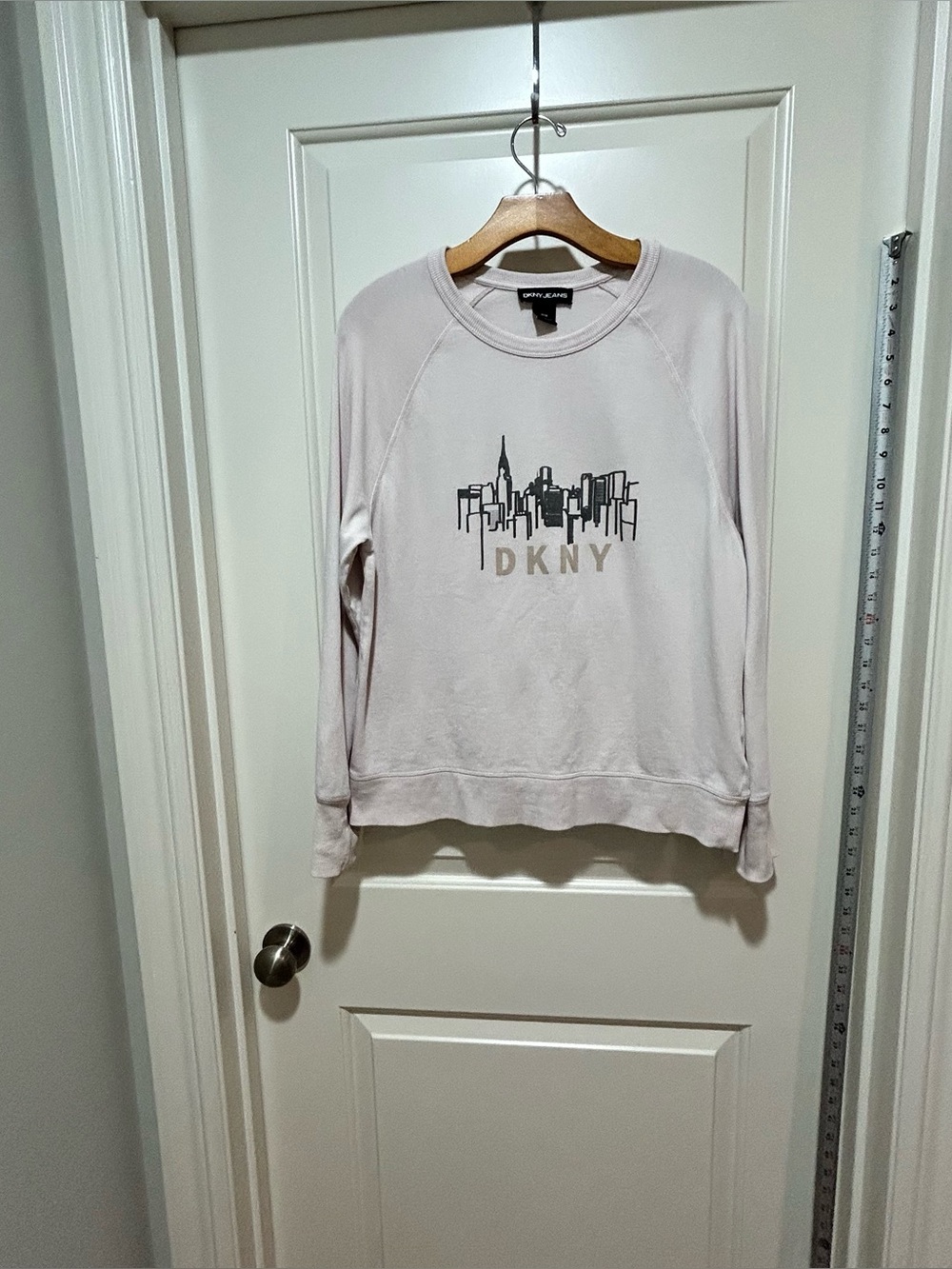 DKNY brand women’s size Light Blush Crewneck Sweatshirt w/ City Skyline Graphi